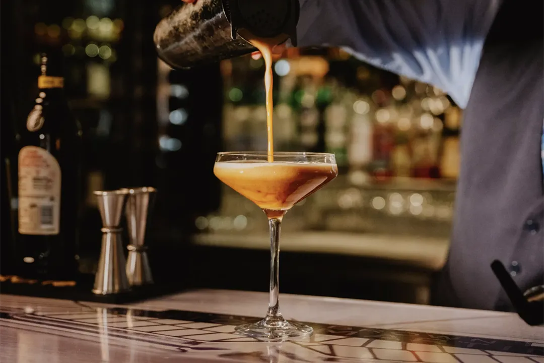 A cocktail being poured at the Spa Hotel bar